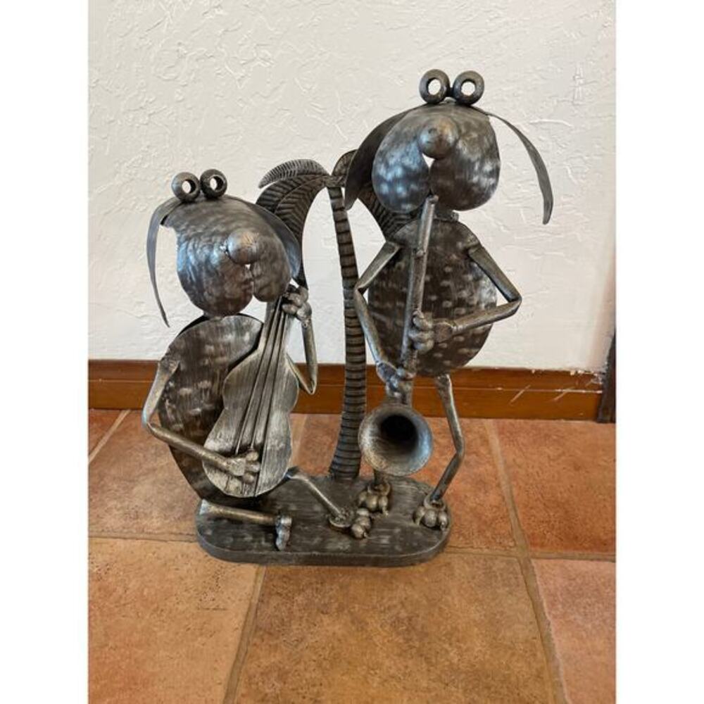 Primitive metal sculpture, two dogs, playing music duet
